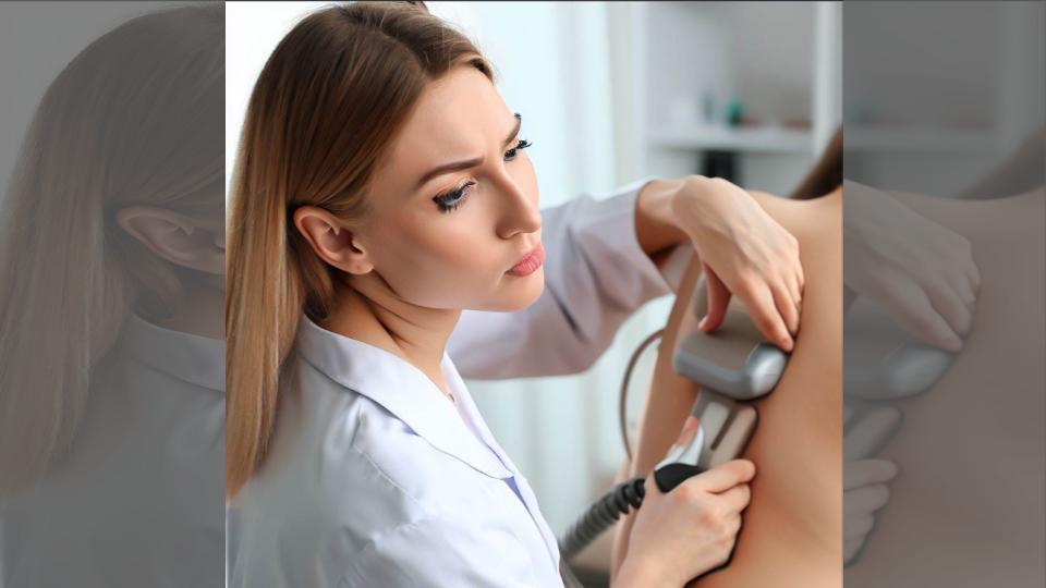 Dermatologist inspecting a patient