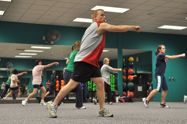 gym room exercise with fitness instructor