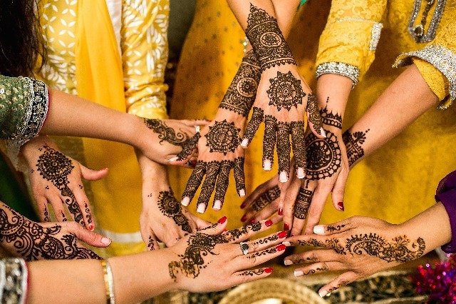 hands with henna art