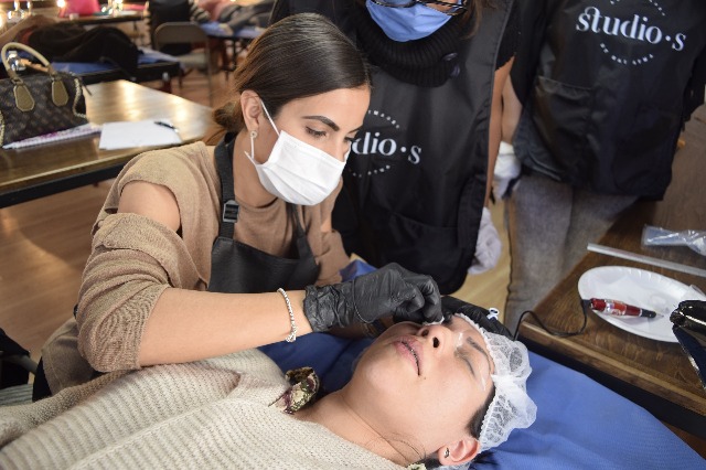 trained staff performing microblading